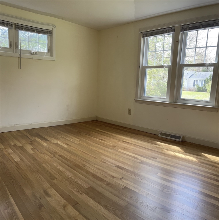 32 Westminster Road Centerville, MA 02632 - Photo 18 of 23 a view of an empty room with wooden floor and a window