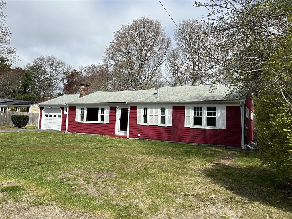 32 Westminster Road Centerville, MA 02632 - Photo 2 of 23 a front view of a house with swimming pool
