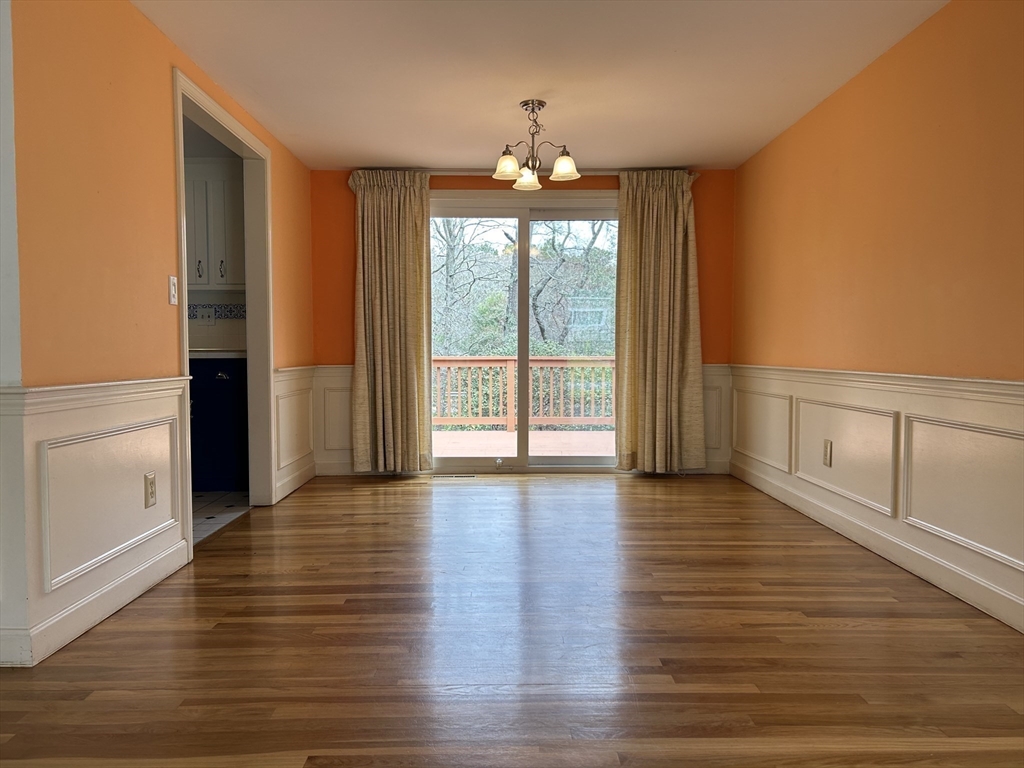 32 Westminster Road Centerville, MA 02632 - Photo 7 of 23 a view of an empty room with wooden floor and a window