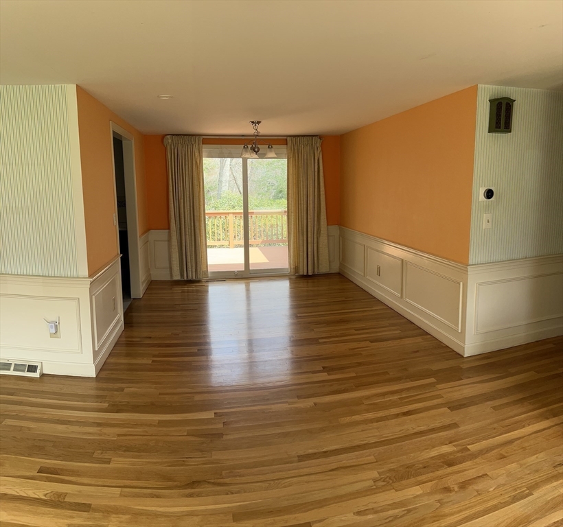 32 Westminster Road Centerville, MA 02632 - Photo 8 of 23 a view of an empty room with wooden floor and a window