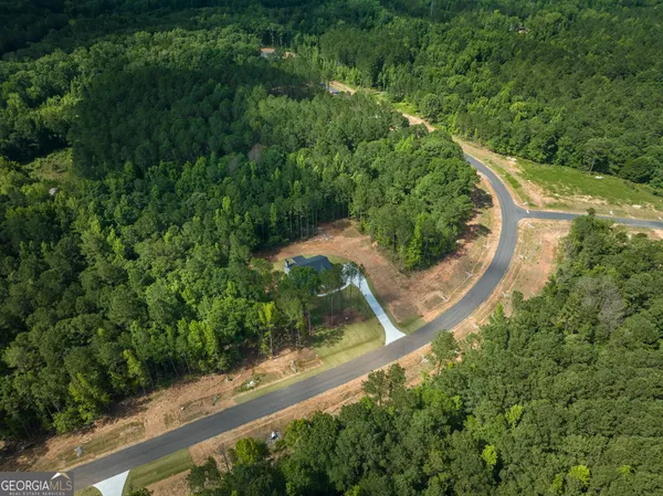 an aerial view of residential house with outdoor space