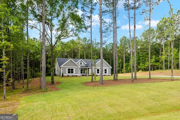 a view of a house with swimming pool and porch with furniture