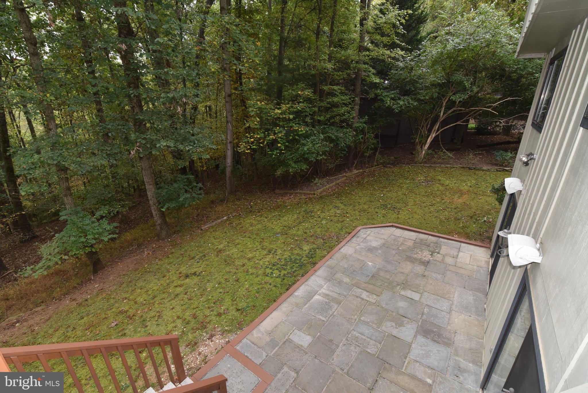 11117 Glade Drive Reston, VA 20191 - Photo 11 of 75 Stairs from deck lead to a flagstone patio & yard.