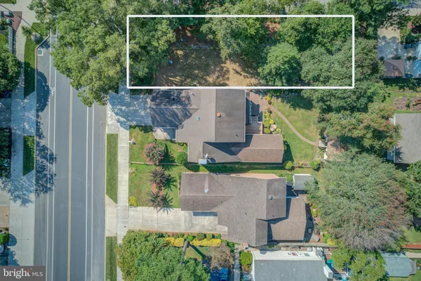 an aerial view of house with a yard