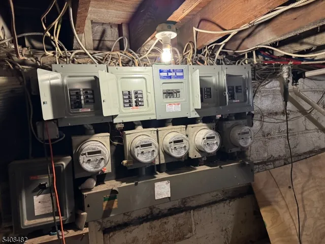 a backyard of a house with barbeque oven table and chairs