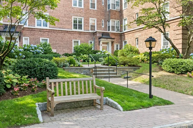 a view of a chair and table in the yard