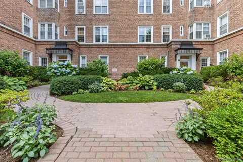 a view of a building with potted plants