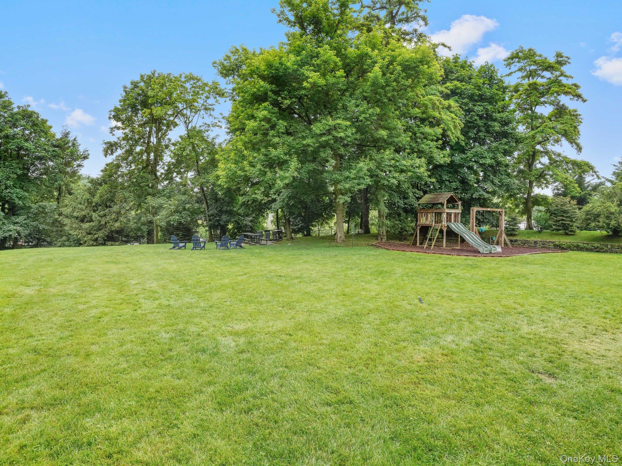 1 Midland Gardens, Unit 4A Bronxville, NY 10708 - Photo 10 of 12 a view of a garden with a tree