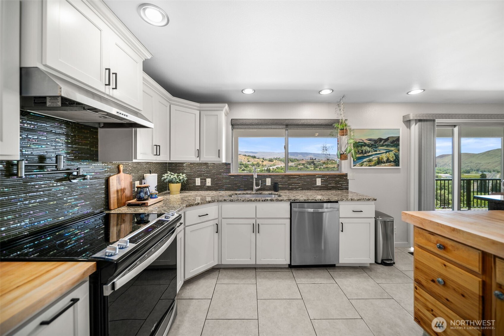 1901 Sleepy Hollow Road Wenatchee, WA 98801 - Photo 13 of 40 a kitchen with stainless steel appliances granite countertop a stove and a sink