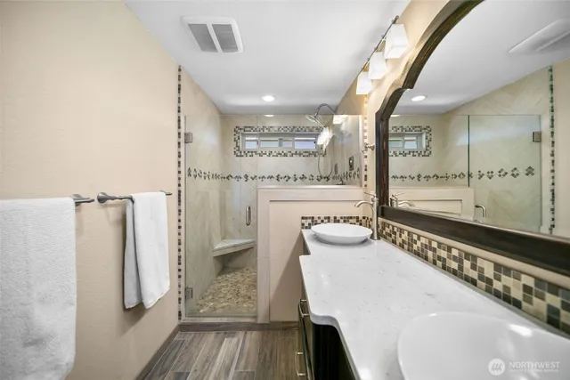 a large white kitchen with a large window