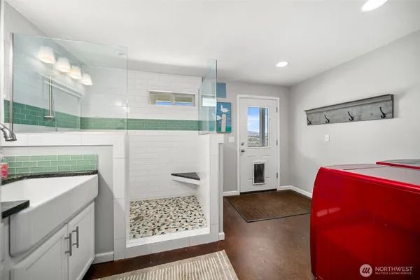 a kitchen with stainless steel appliances granite countertop a refrigerator and a stove