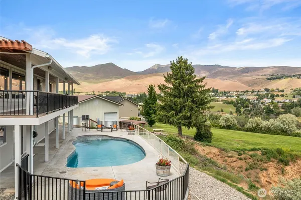 an outdoor view of house with swimming pool