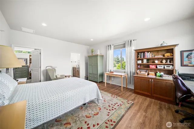 a bedroom with a bed furniture and a window