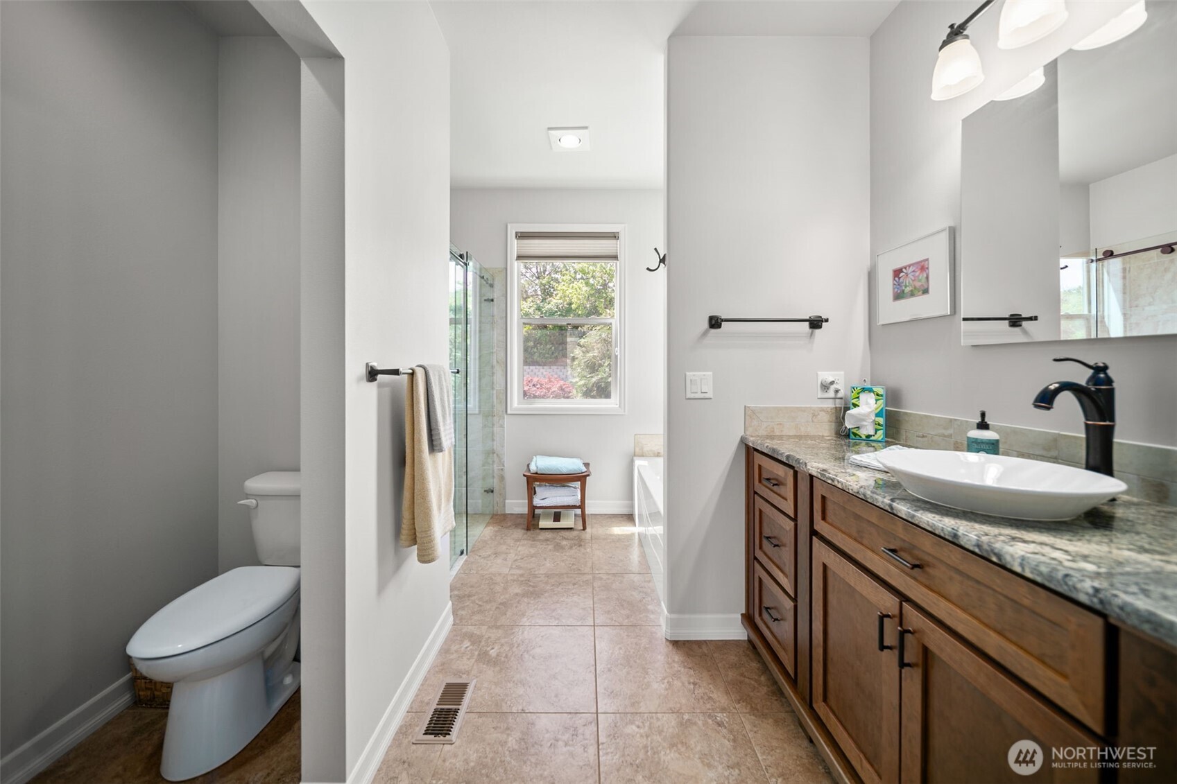 1901 Sleepy Hollow Road Wenatchee, WA 98801 - Photo 38 of 40 a spacious bathroom with a granite countertop sink toilet and shower