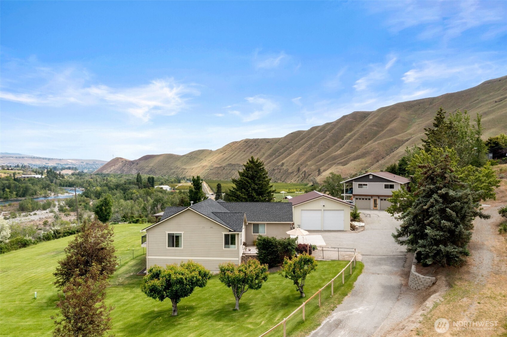1901 Sleepy Hollow Road Wenatchee, WA 98801 - Photo 4 of 40 a view of a house with a mountain in the background