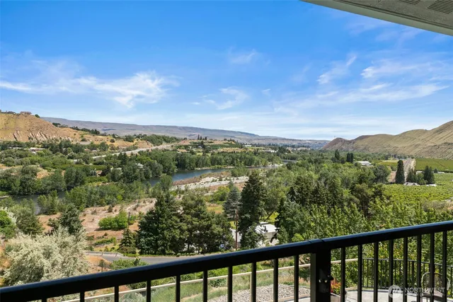 a view of a green landscape from a balcony