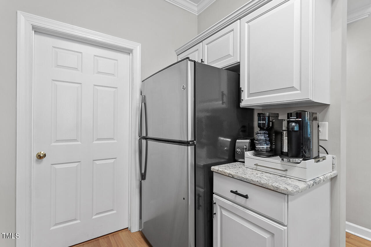 200 South Dawson Street, Unit 203 Raleigh, NC 27601 - Photo 18 of 35 Spacious kitchen features stainless steel appliances, granite countertops & storage opening to the dining & living room spaces.