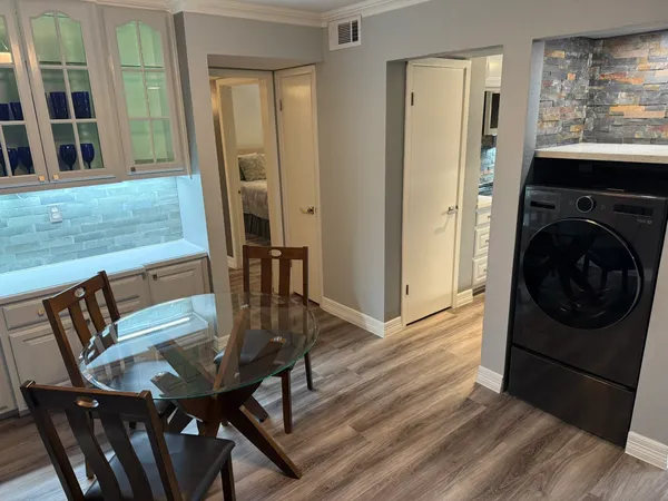 a view of a dining room with furniture window and wooden floor