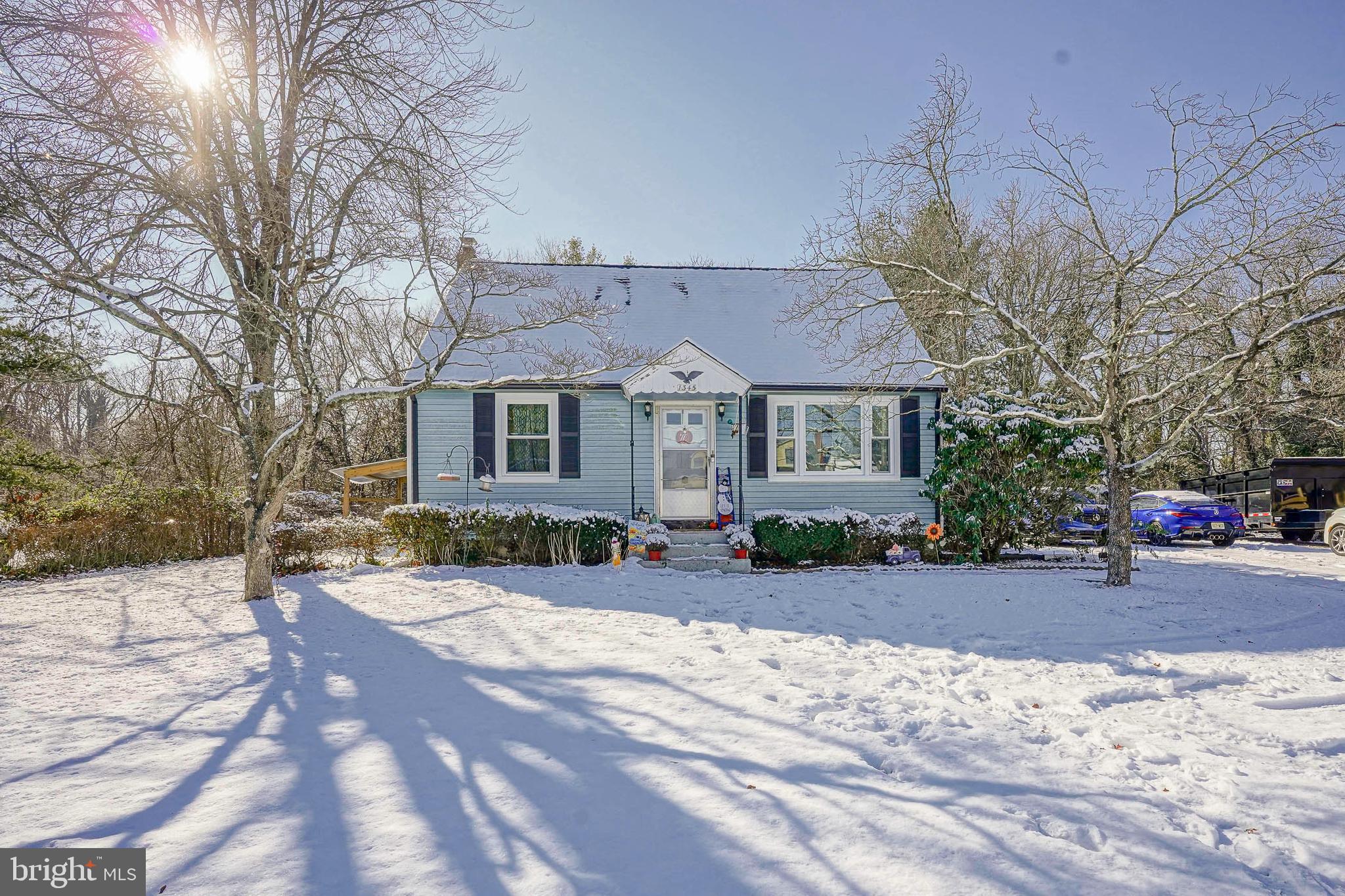 a front view of a house with a yard and a garage