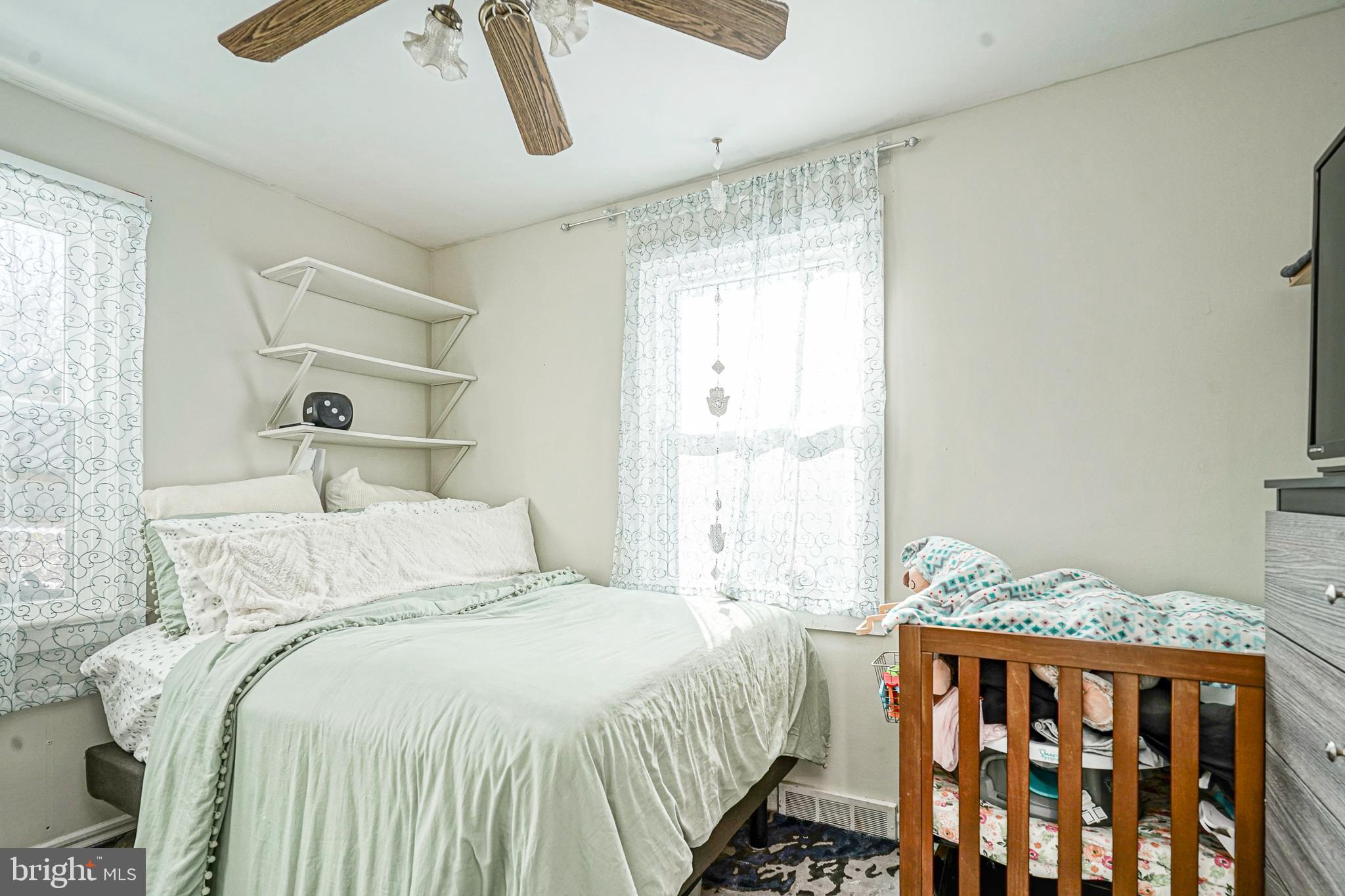 1345 East Walnut Road Vineland, NJ 08361 - Photo 12 of 26 a bedroom with a bed and wooden floor