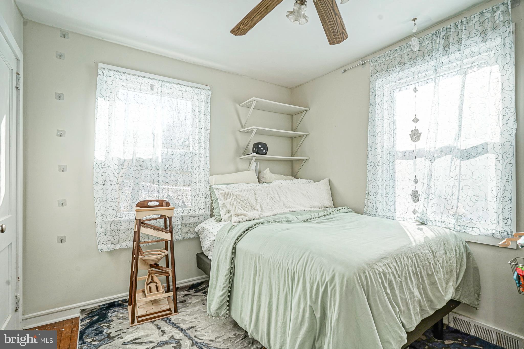 1345 East Walnut Road Vineland, NJ 08361 - Photo 13 of 26 a bed sitting in a bedroom next to a window