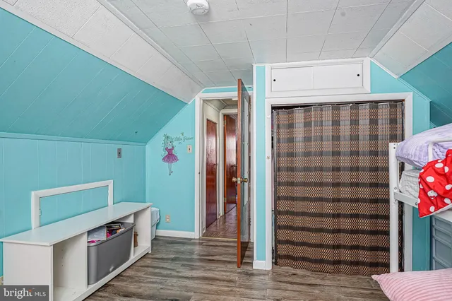 a bathroom with a sink a toilet a mirror and shower