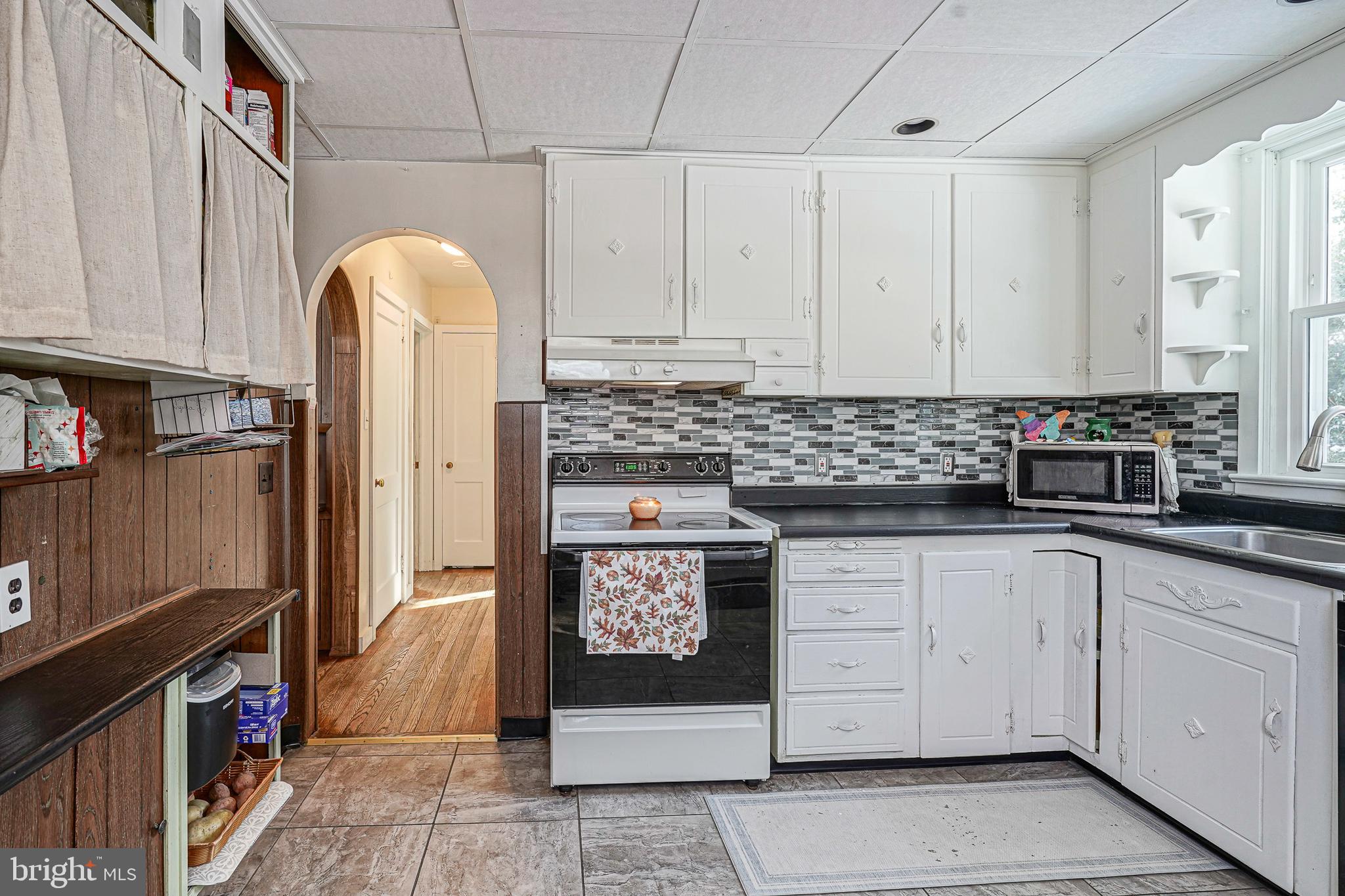 1345 East Walnut Road Vineland, NJ 08361 - Photo 8 of 26 a kitchen with stainless steel appliances granite countertop a stove a sink and a refrigerator