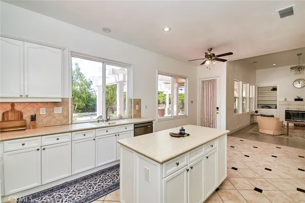 a kitchen with a stove a sink and a refrigerator