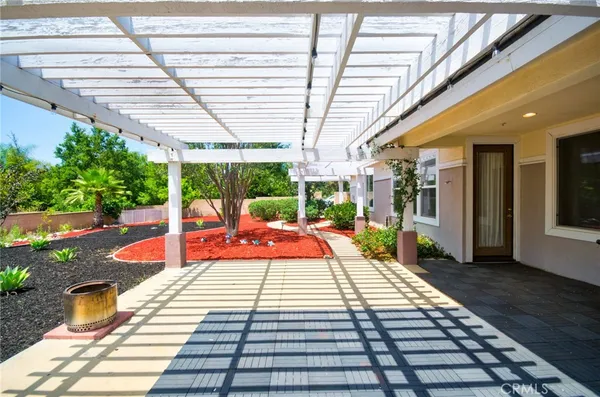 a view of a swimming pool with a patio