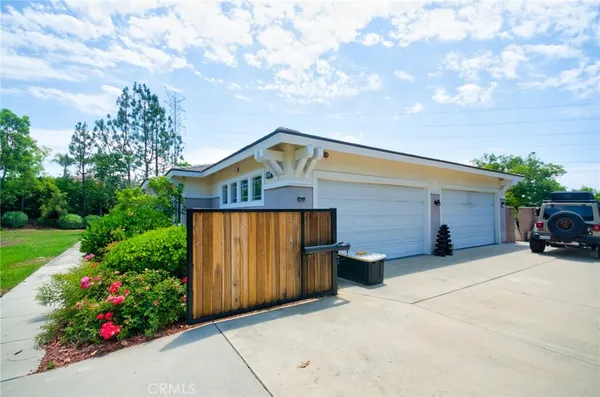 a view of a house with a yard and garage