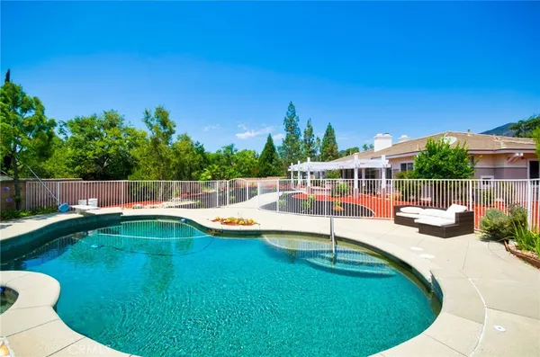 a view of a swimming pool with a lounge chair