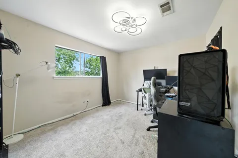 a view of room with workspace and mirror