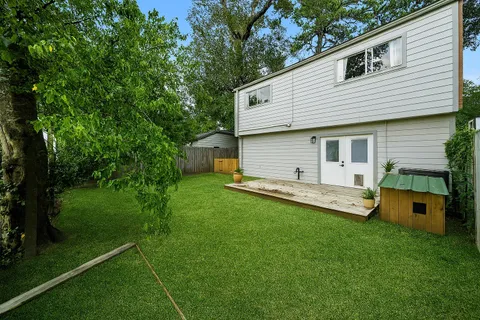 a view of a house with a backyard
