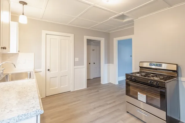 a kitchen with a stove and a sink