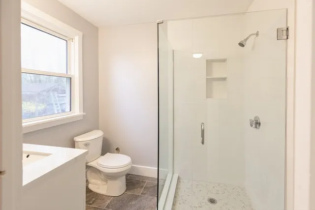 a bathroom with a toilet a sink and a bathtub