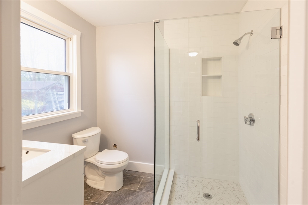 235 Standish Avenue Plymouth, MA 02360 - Photo 8 of 17 a bathroom with a toilet a sink and a bathtub