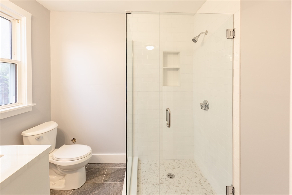 235 Standish Avenue Plymouth, MA 02360 - Photo 9 of 17 a bathroom with a toilet and a shower