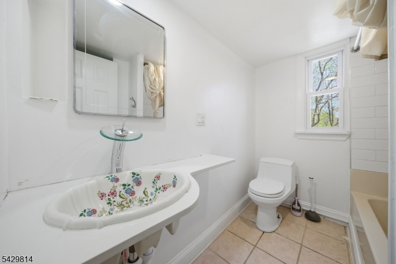 251 Russia Road Oak Ridge, NJ 07438 - Photo 21 of 34 a bathroom with a sink toilet and mirror