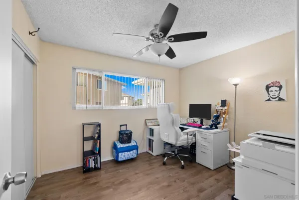 a bathroom with a sink a toilet and shower curtain