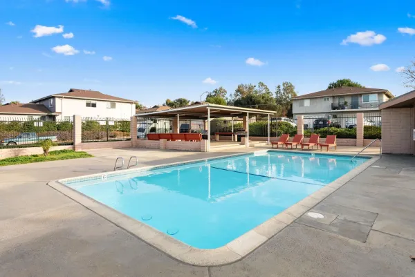 a view of a backyard with sitting area