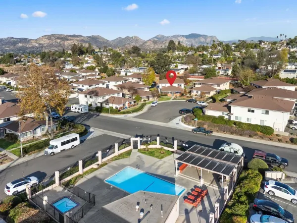 an aerial view of residential houses and outdoor space