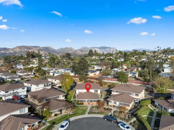 an aerial view of residential building with parking space