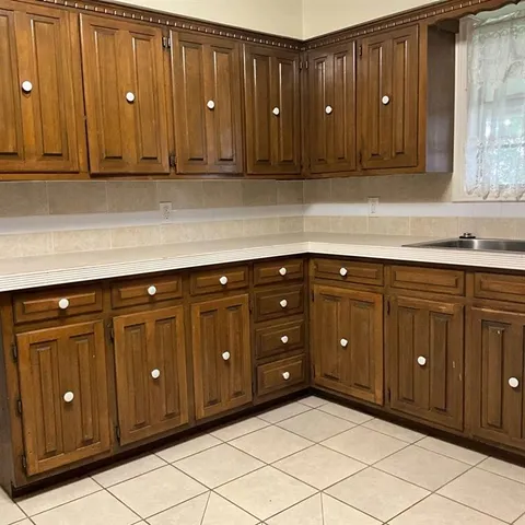 a kitchen with a sink and cabinets