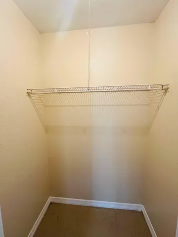 a view of a room with racks on the wall