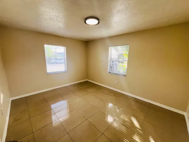 a view of an empty room and window