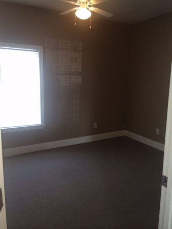 186 Diman Street Fall River, MA 02721 - Photo 6 of 6 a view of an empty room with a window