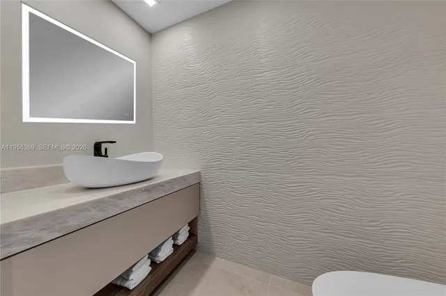 a view of a livingroom with an empty space and a hallway