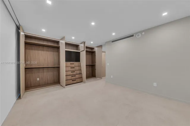 a view of an empty walk in closet