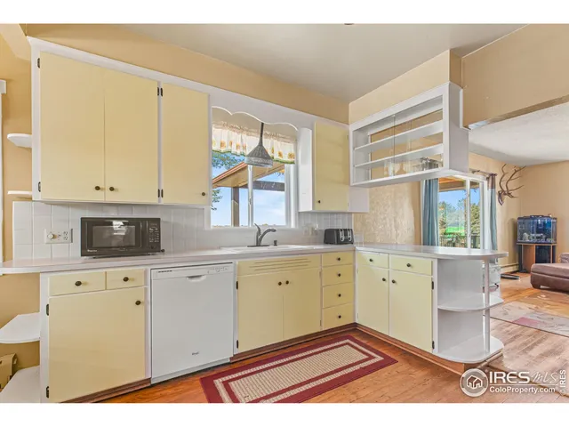a kitchen with a refrigerator and a sink