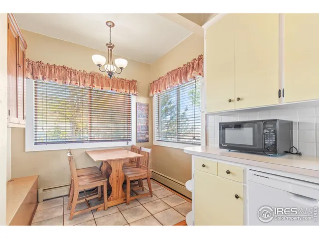 a view of kitchen with wooden floor